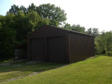 The detached 44 x 28 garage , 14 foot overhead doo