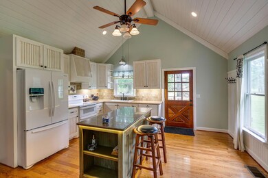 Vaulted ceilings in the kitchen add to the charm of this farmhouse