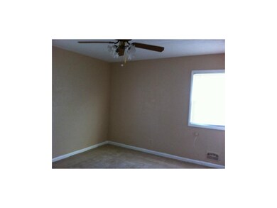 Master bedroom has a fan and 1/2 bath.