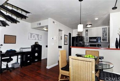 View from family room to kitchen and bar area.