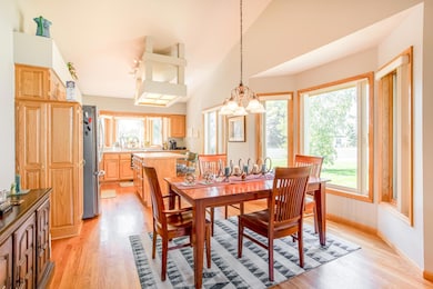Bright dining space with bay window seating, seamlessly connected to the open kitchen.