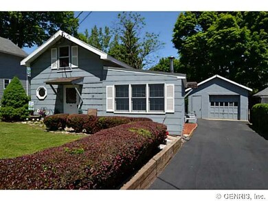 Exterior Front. House with detached garage.