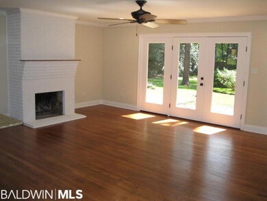 Hardwood floors, wood burning fireplace, and frenc