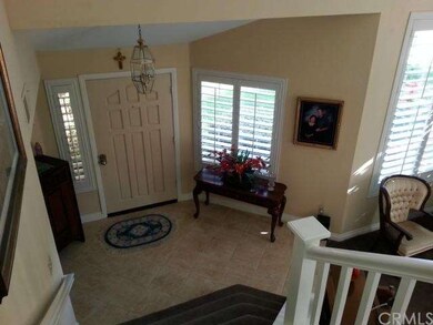 Looking down to Entry from stair landing. Traverti