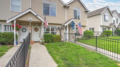 This fully-fenced front yard and walk provides a wonderful entrance for family and guests