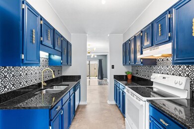 Kitchen featuring light tile patterned flooring, w