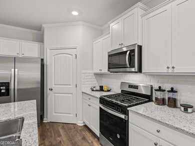 Sudbury townhome kitchen with stainless-steel appliances and walk-in closet