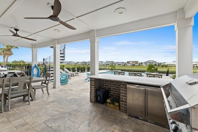 View of patio with stairs and a ceiling fan