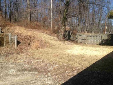 Easy to maintain backyard with trees shading from 