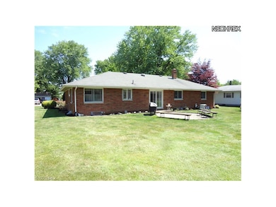 Back view, sliding patio doors open up to back yar