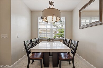 Dining space with baseboards, a notable chandelier