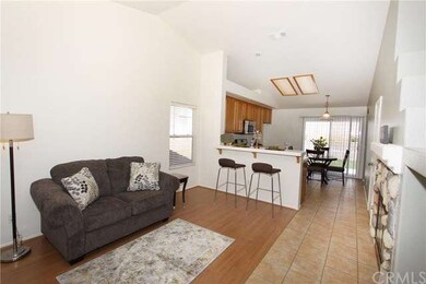 Family room with view of Kitchen breakfast bar.