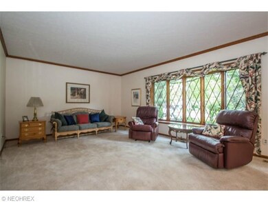 Spacious Living Room with French Doors Leading to 