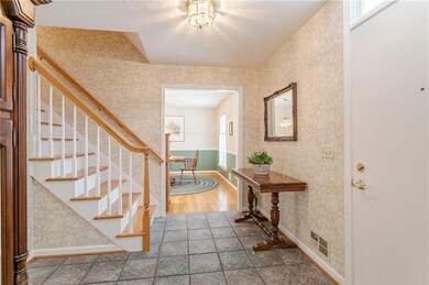 Step inside to the open entry with central stairca