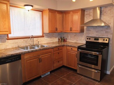 Remodeled kitchen with stainless steel appliances.