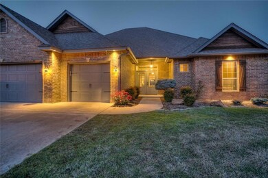 View of front of house with french doors, roof wit