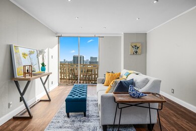 The updated living room offers floor to ceiling vi