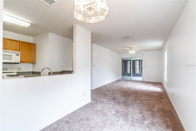 Dining and Living Rooms with views of Kitchen and 