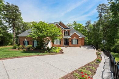 The house has an aggregate driveway, parking court, and side walkway from street.