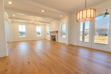 Unfurnished living room featuring beamed ceiling, 