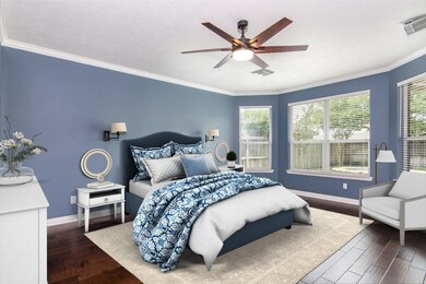 Primary bedroom is down with a pool view, wood floors and updated ensuite bath!