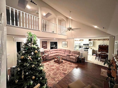 Lofted den overlooks Grand Room
