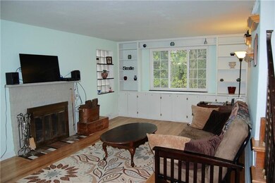 Living Room with wood burning fireplace and views 