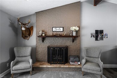 Vaulted Living Room with Brick Front Gas Log Firep