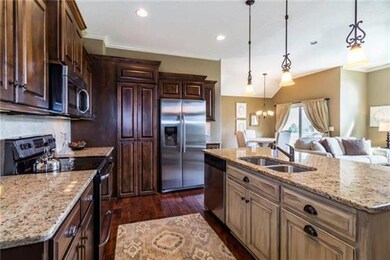 Large island and walk-in pantry make for plenty of