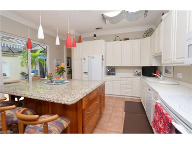 Cheerful kitchen view shows ample prep & storage s
