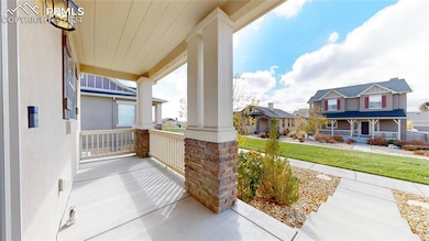 Covered front porch faces West towards a community