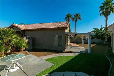 Nicely landscaped yard with artificial turf
