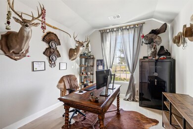 Home office featuring light hardwood / wood-style 