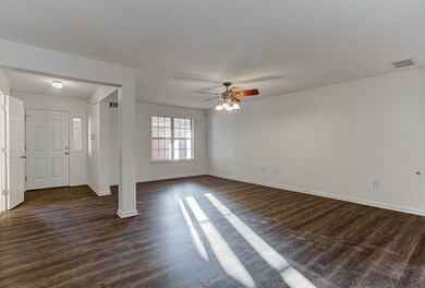 Interior space with dark hardwood / wood-style flo