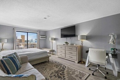 Bedroom with access to exterior, ornamental moldin