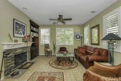 Living room features a cozy fireplace and built-in