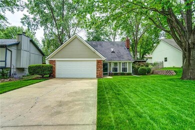 House sits on a well-groomed lot w/ lush landscapi