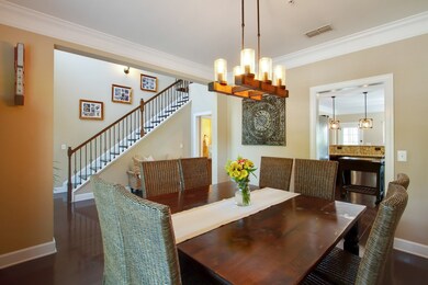 Gorgeous formal dining room with updated lighting! Hardwoods here too!