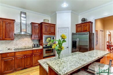Appealing kitchen has beautiful rich cabinets and 