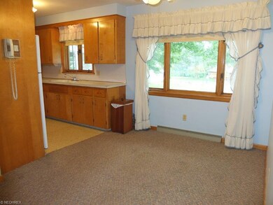 Another view of the dinette and kitchen.