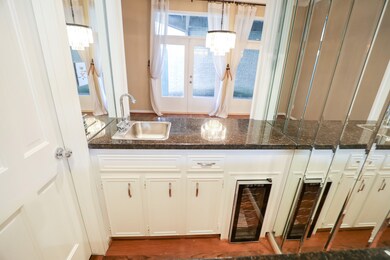 This stylish wet bar is equipped with a built-in s