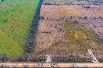 Full Lot view, it goes past the first tree line