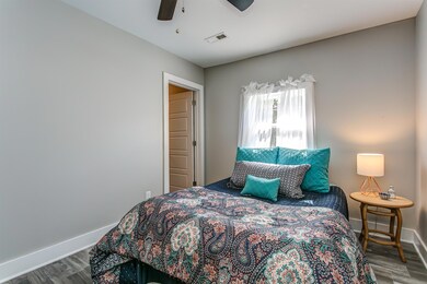 This cozy bedroom has an en suite bath.