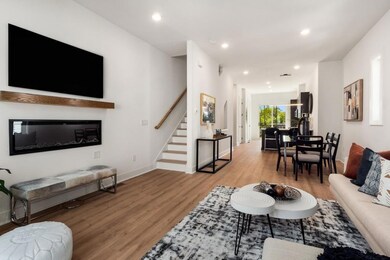 Living room with light hardwood / wood-style floor