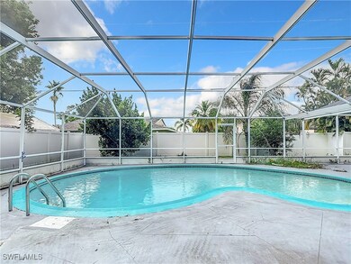 View of swimming pool with a patio area and glass