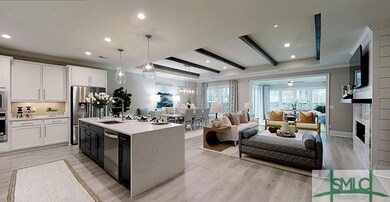 Vire of gourmet kitchen and great room from foyer.