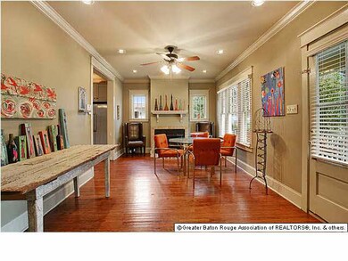Dining room with fireplace and beautiful wood floo