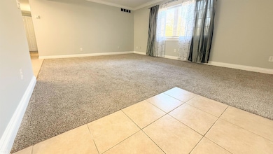 •   Large living room highlighted by a big picture window that floods the space with natural light.    •   Fresh paint and neutral carpet create a turnkey environment