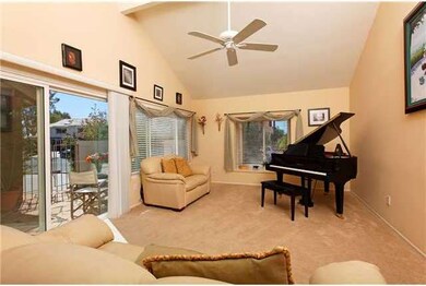 Living room with adjacent enclosed patio.
