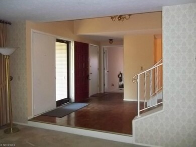 View from step down living room towards the foyer.